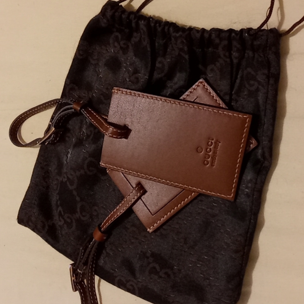 GUCCI luggages tags holders.